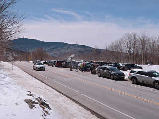 Cars crammed into the trailhead lot