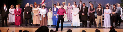 Curtain call, audience invited to come up and tour set