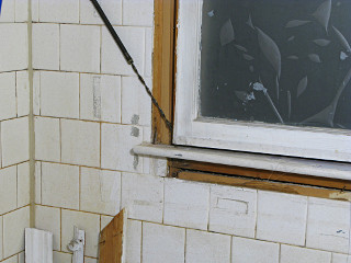 Window sash counterweight spring mechanism