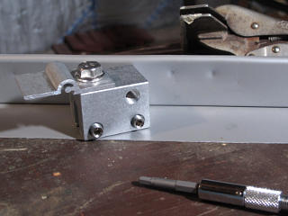 Testing snow-rail clamps on standing seam sample