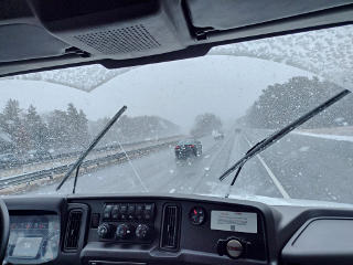 Huge snowflakes coming down on highway