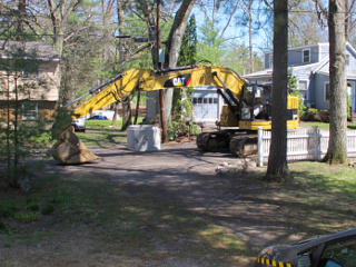 Excavator moves into place