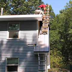 Lowering chicken-ladder into place